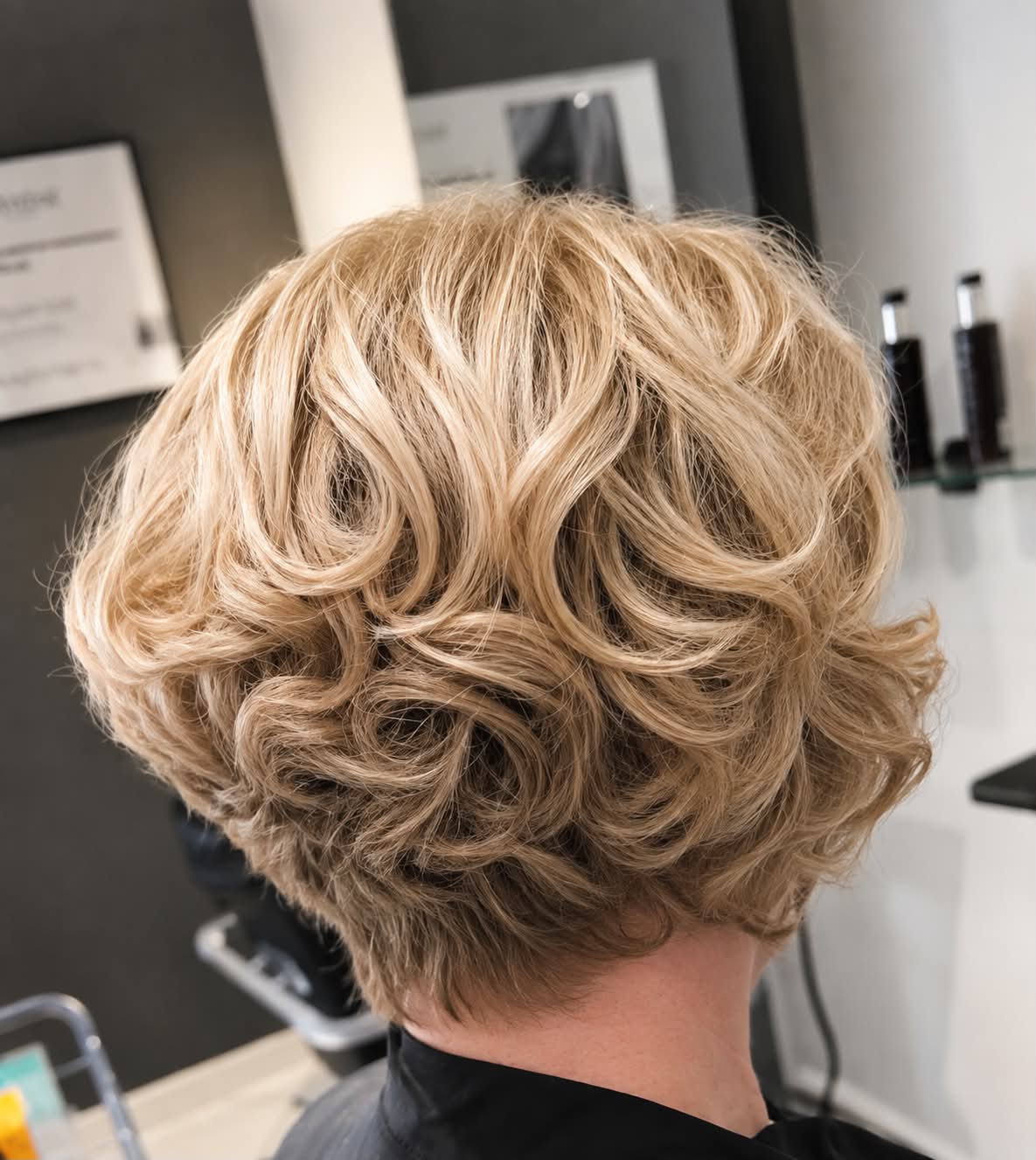 Short blonde textured style with soft curls, created at Strands